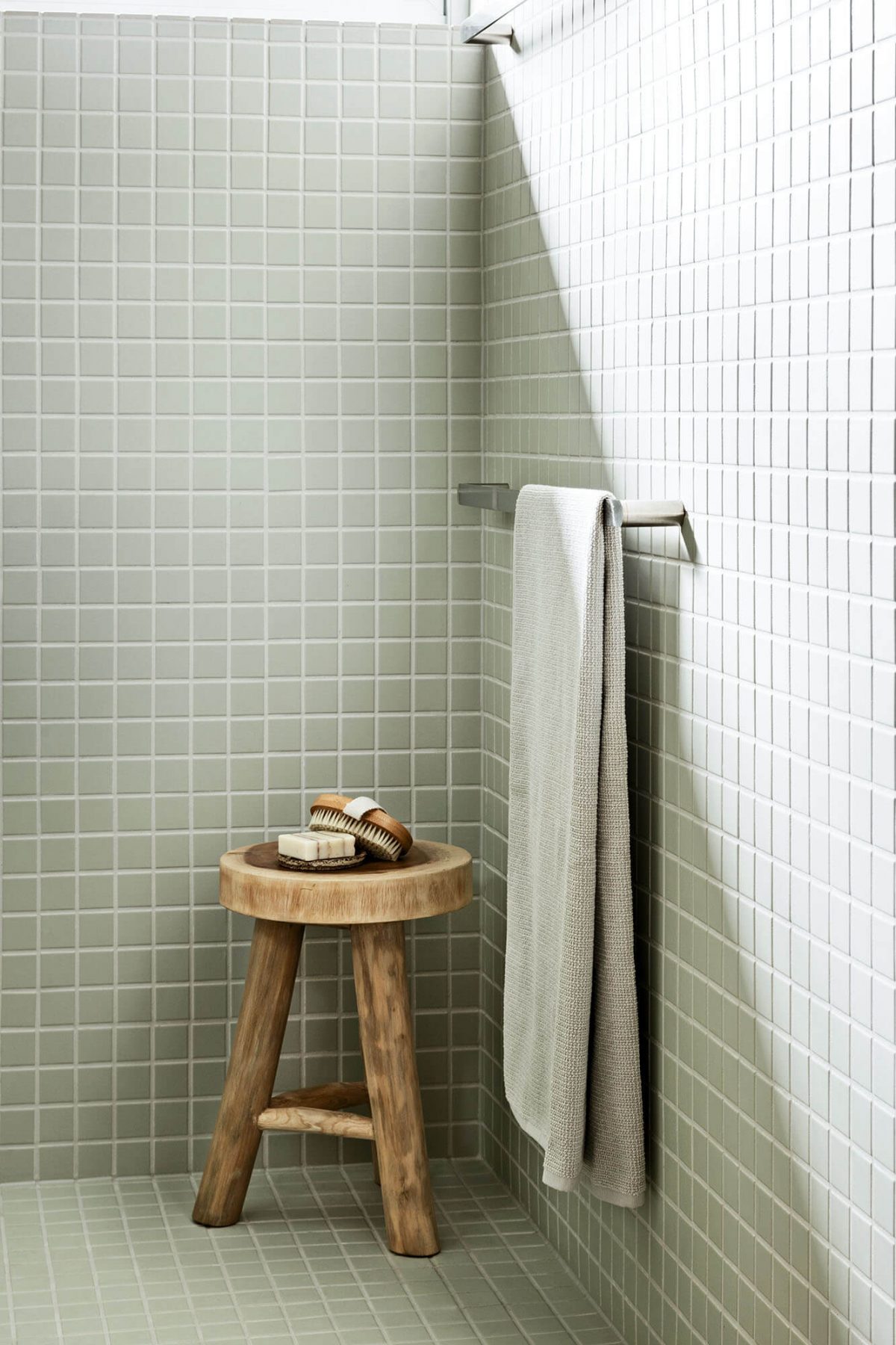 Custom bathroom featuring green tiles designed and built by MJ Harris