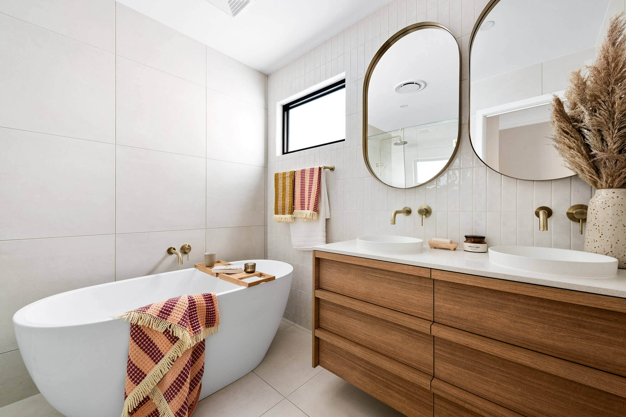 A custom designed bathroom featuring custom joinery. Designed and built by MJ Harris Group.