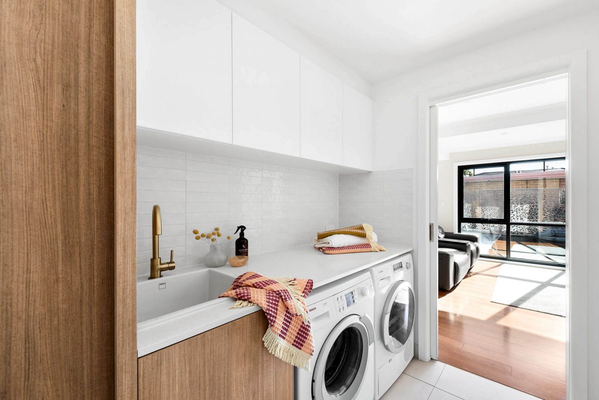 A custom designed laundry. Designed and built by MJ Harris Group.