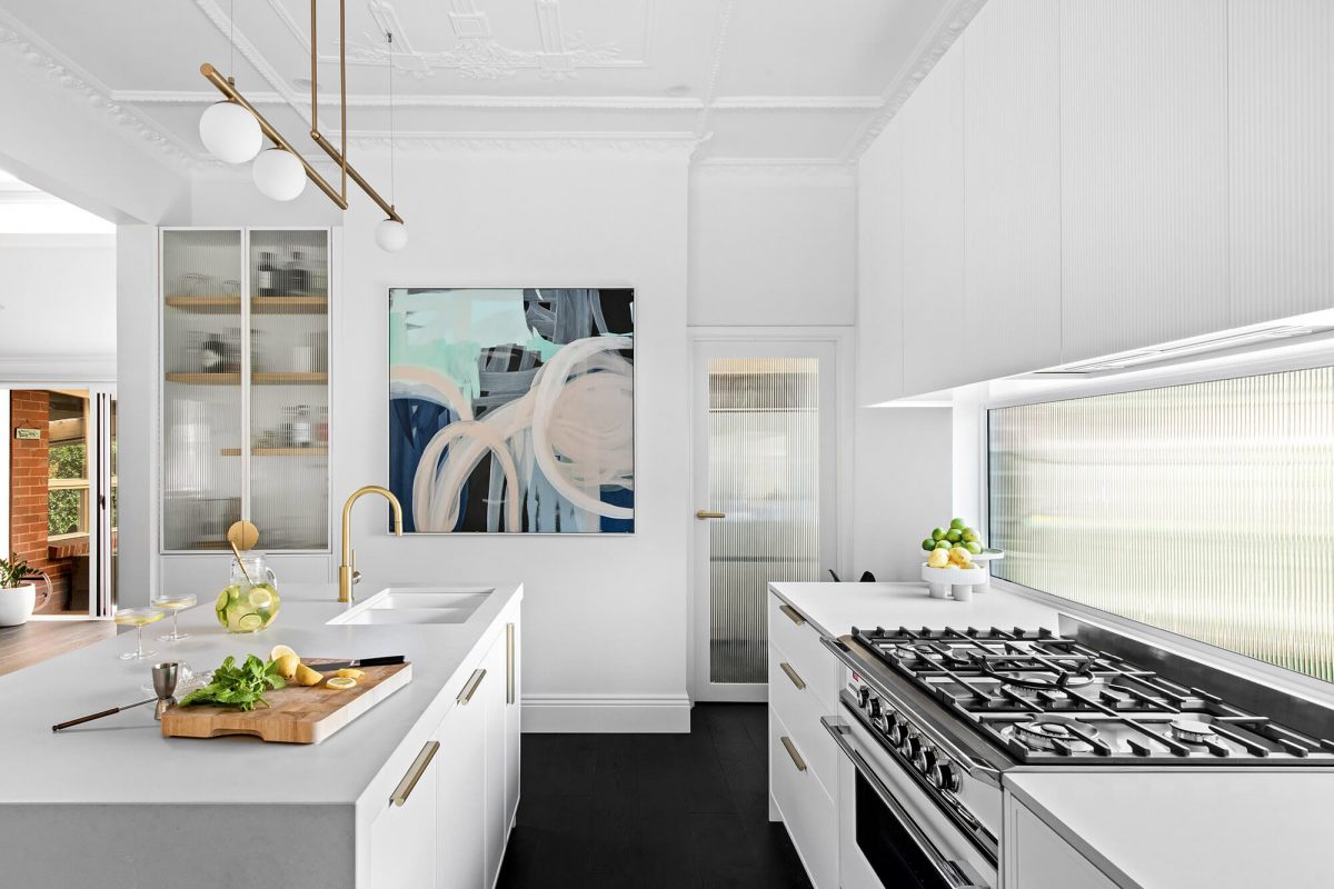 A custom designed kitchen with a monochromatic design. Designed and built by MJ Harris Group.