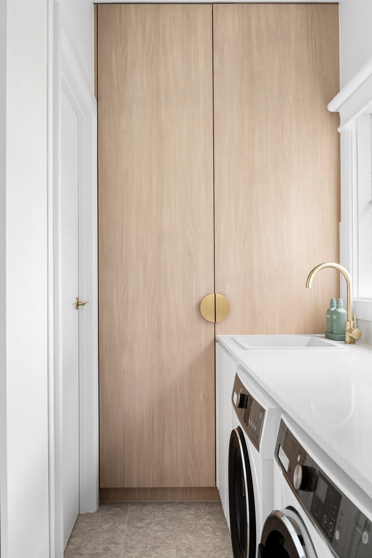 A custom designed laundry. Designed and built by MJ Harris Group.
