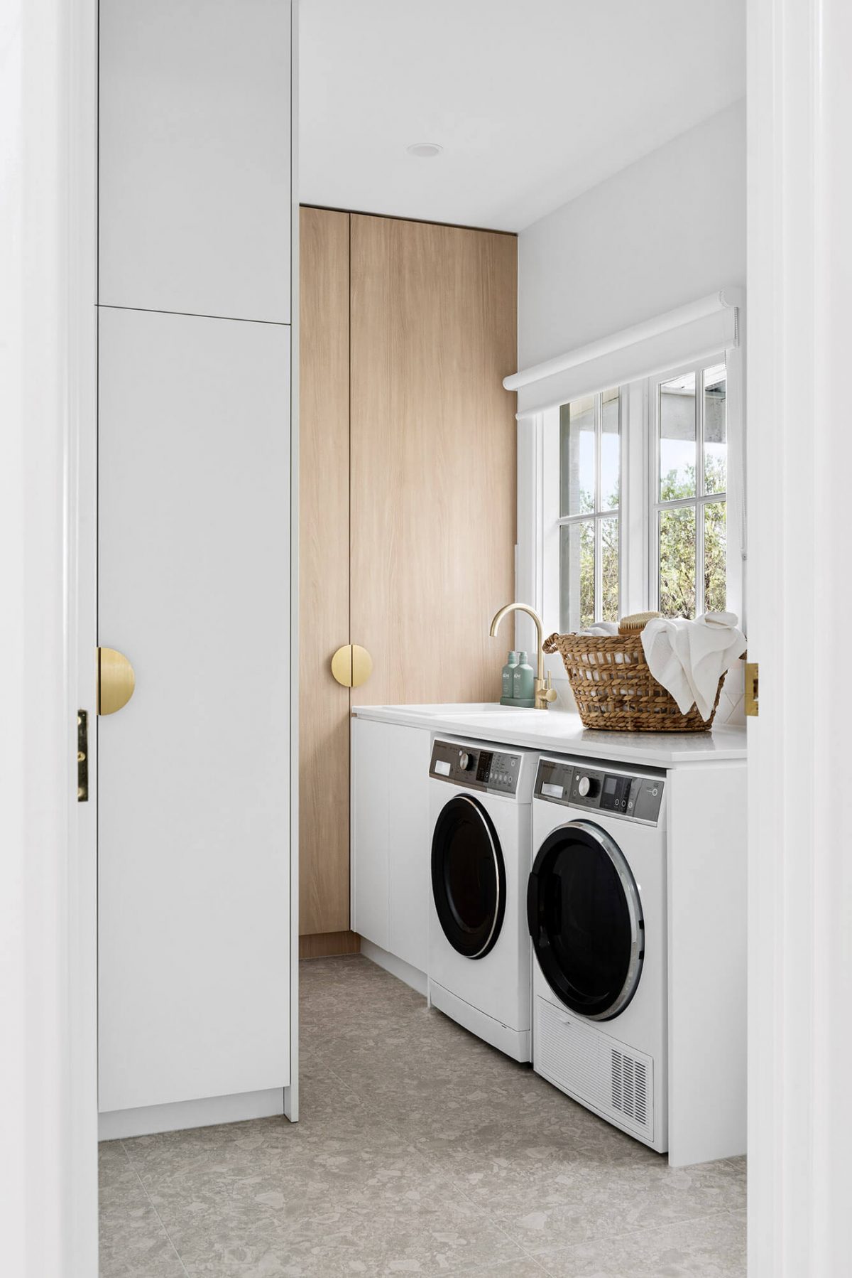 A custom designed laundry. Designed and built by MJ Harris Group.