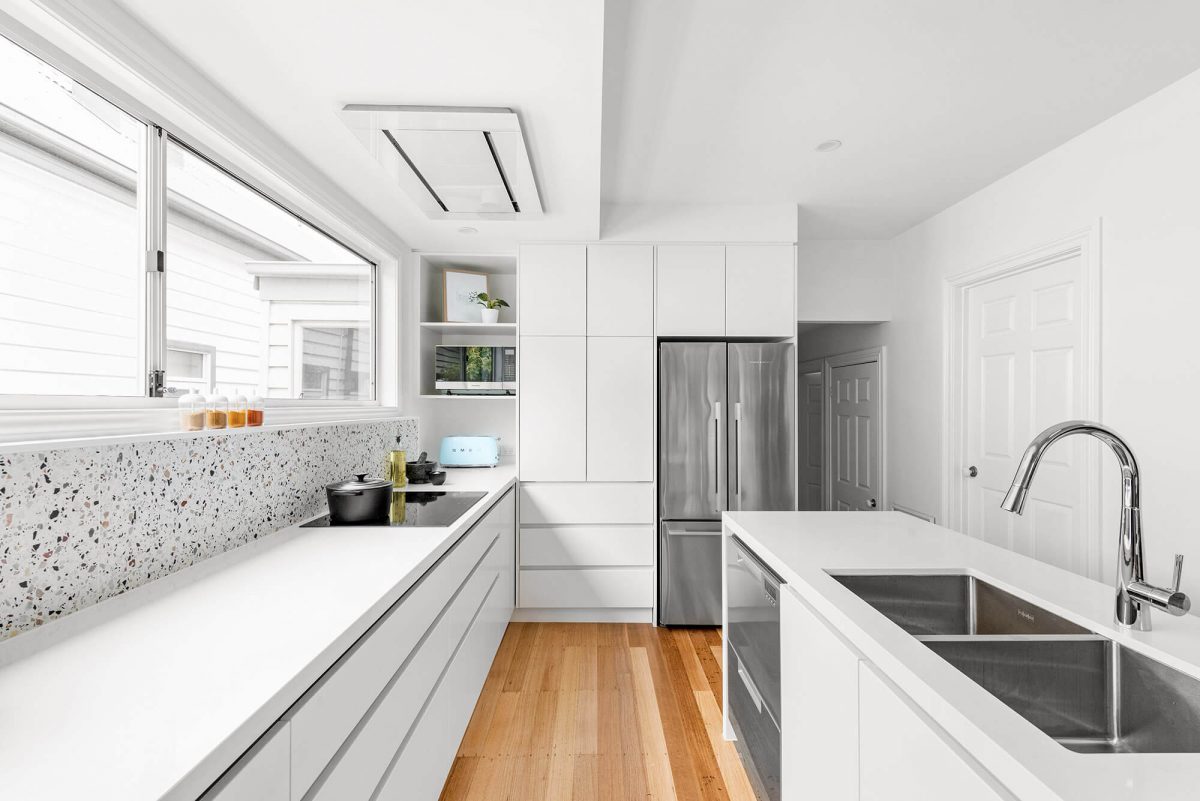 A custom designed white kitchen. Designed and built by MJ Harris Group.
