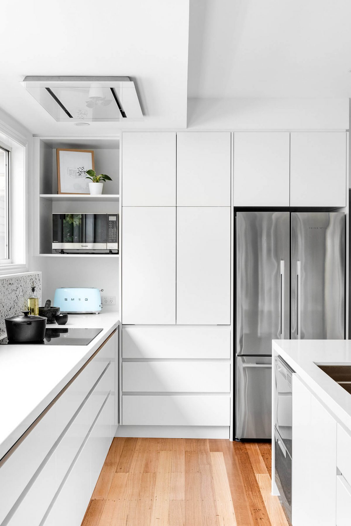 A custom designed white kitchen. Designed and built by MJ Harris Group.