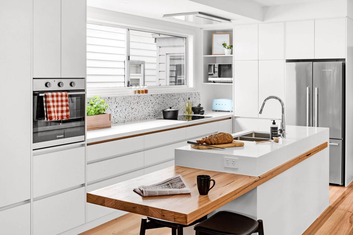 A custom designed white kitchen. Designed and built by MJ Harris Group.