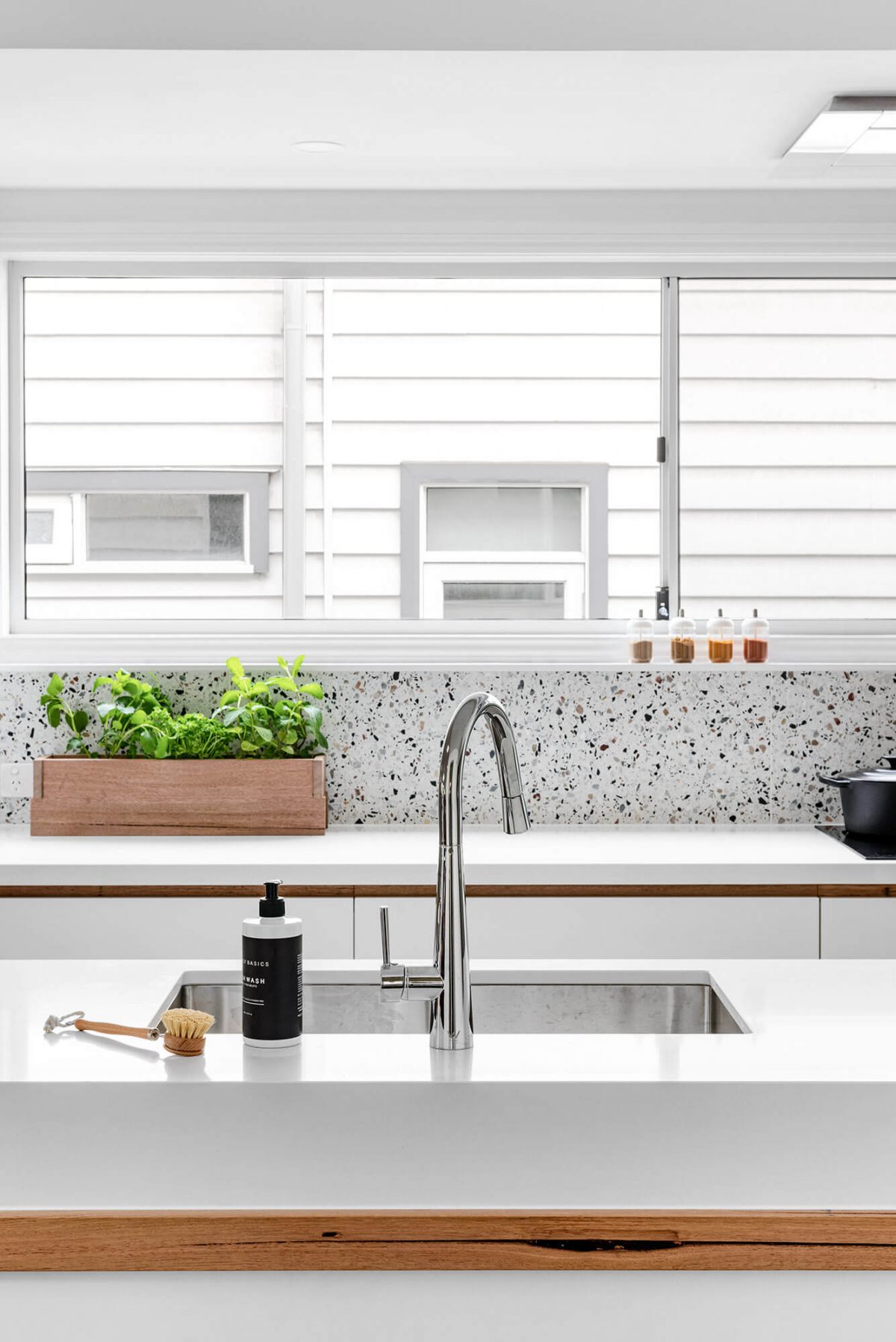 A custom designed white kitchen. Designed and built by MJ Harris Group.