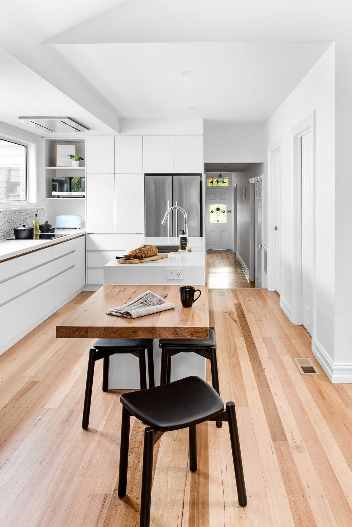 A custom designed white kitchen. Designed and built by MJ Harris Group.