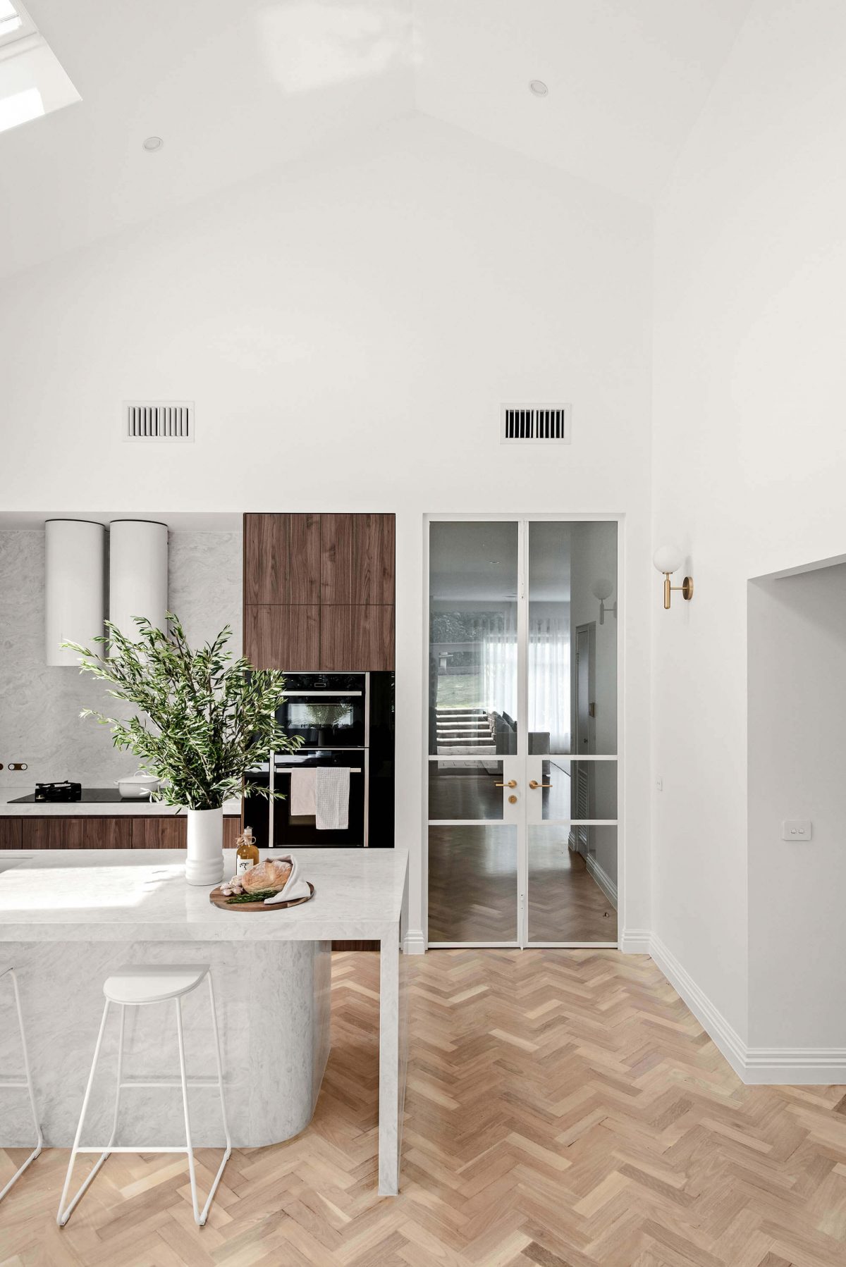 A custom designed kitchen featuring earthy tones. Built by M.J. Harris Group
