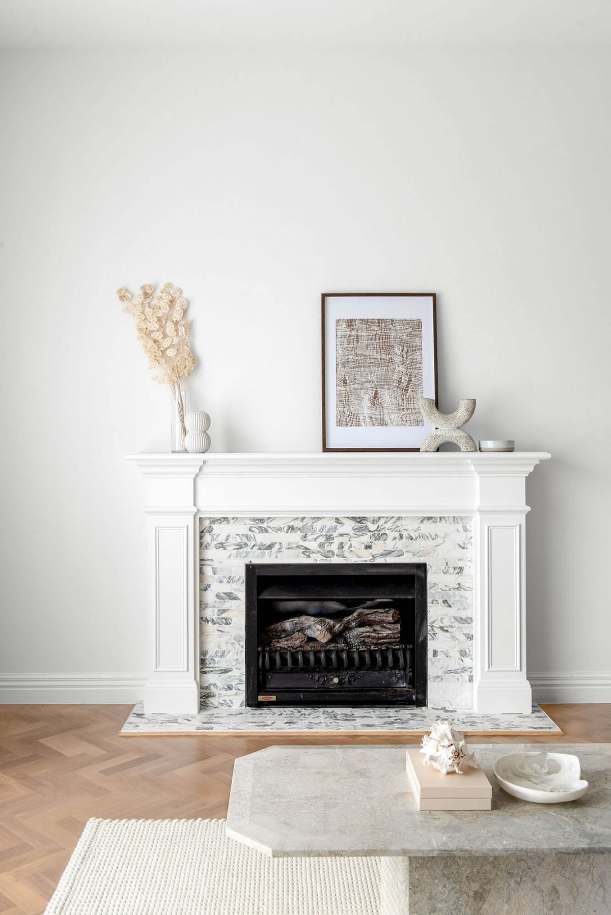 White mantle piece with marble stone surround in Eaglemont, Melbourn