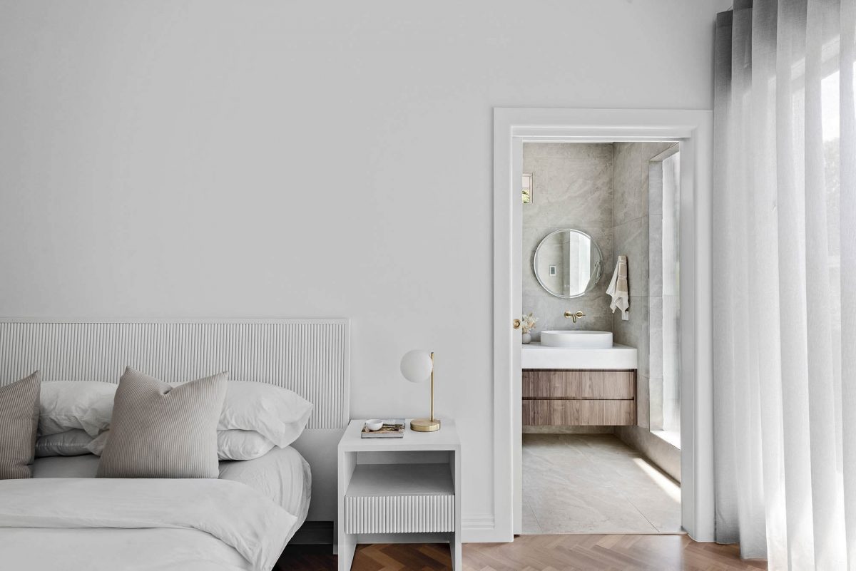 A custom designed bedroom and the bathroom. Built by M.J. Harris Group