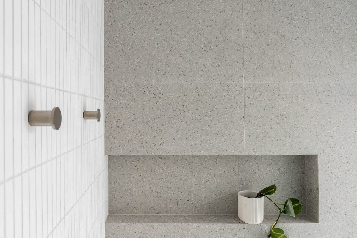 A custom designed ensuite bathroom featuring a grey tiles. Designed and built by MJ Harris Group. #MJHxEdinburghSt