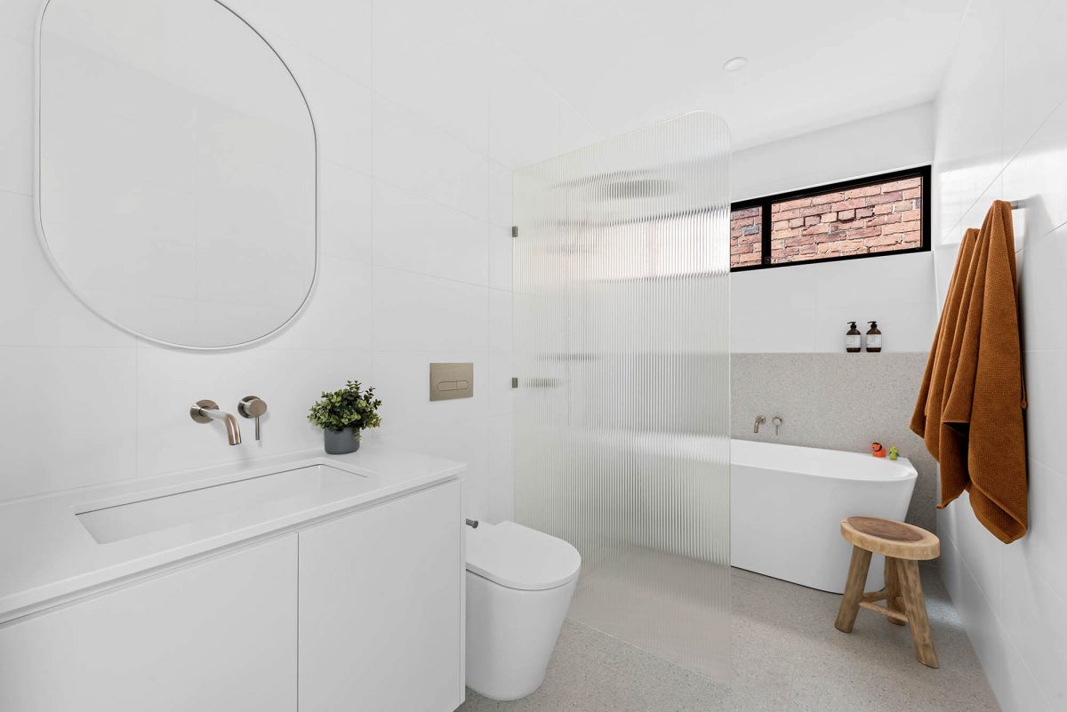 A custom designed ensuite bathroom featuring a free standing tub. Designed and built by MJ Harris Group. #MJHxEdinburghSt