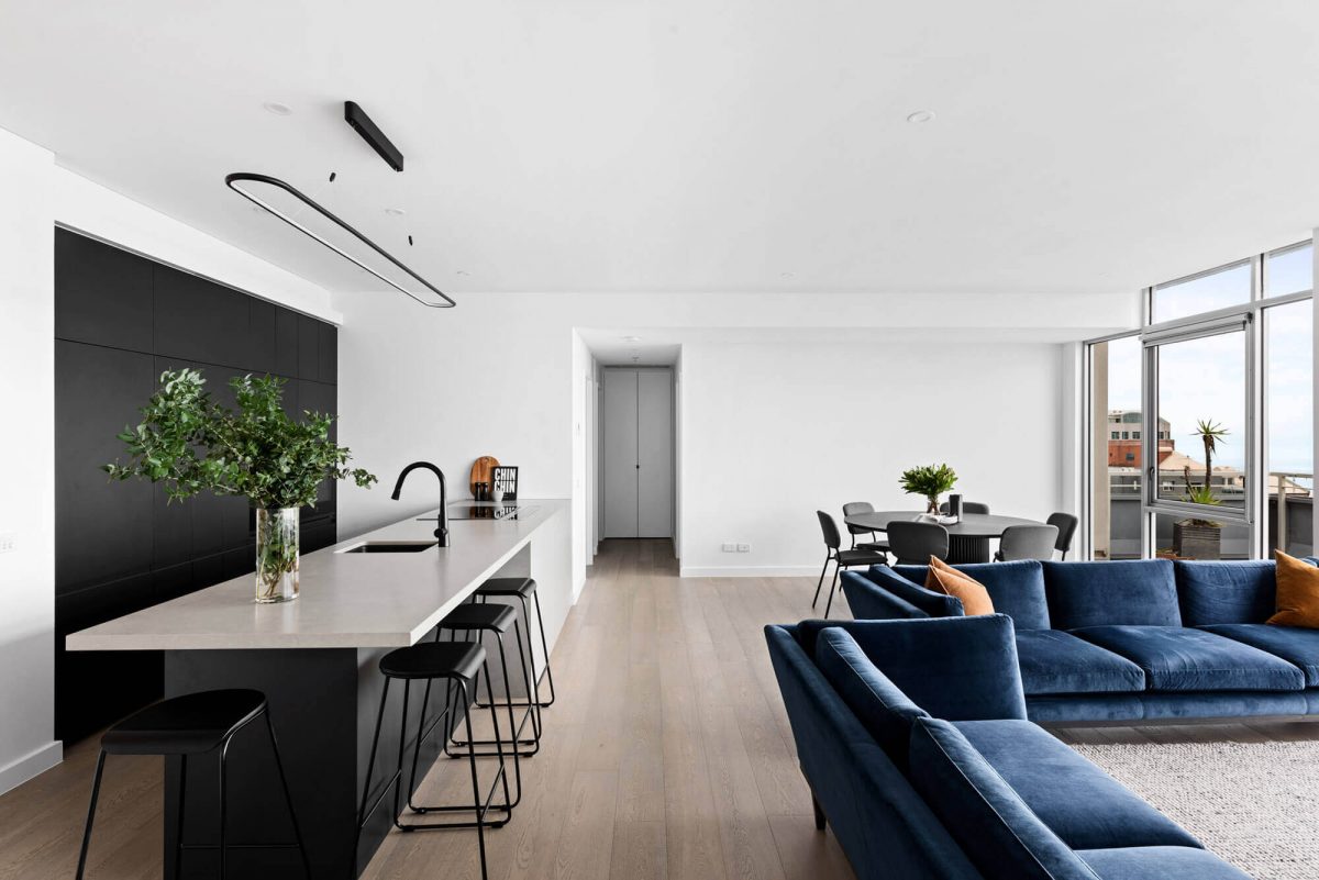 A custom designed monochromatic kitchen. Designed and built by MJ Harris Group.