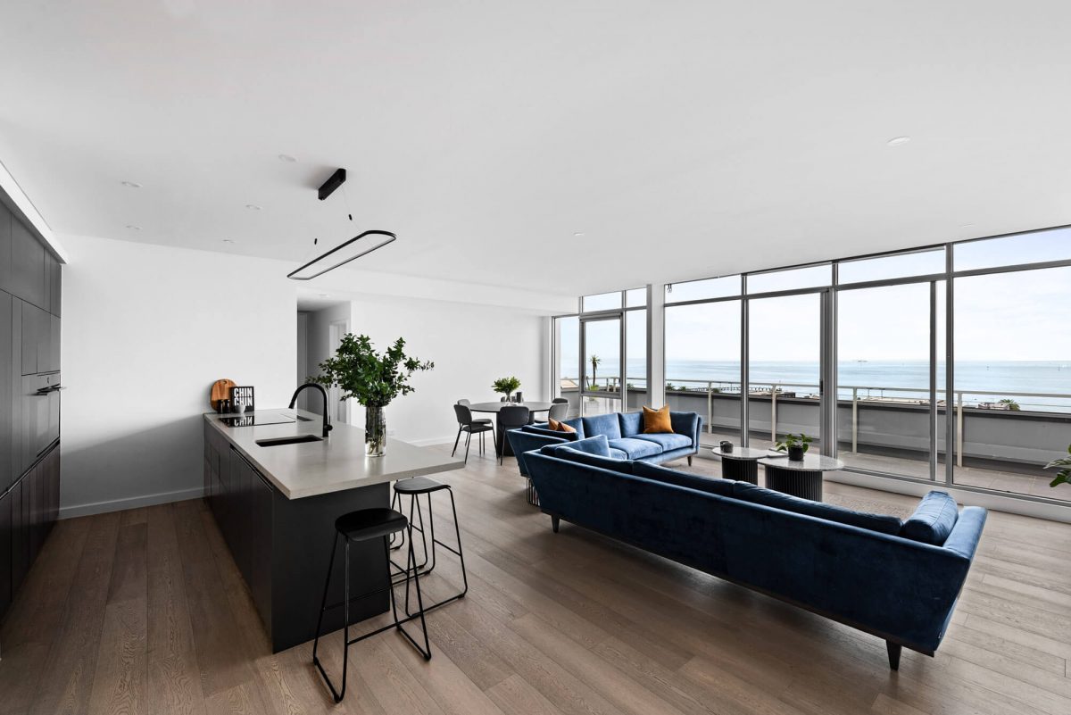 A custom designed monochromatic kitchen. Designed and built by MJ Harris Group.