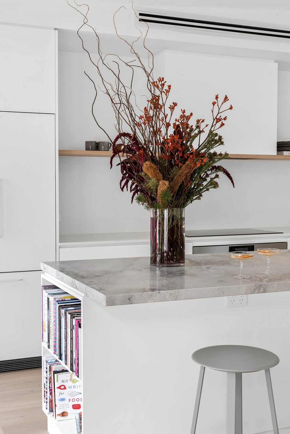 A custom designed kitchen featuring a natural stone kitchen island. Designed and built by MJ Harris Group. #MJHxEdinburghSt