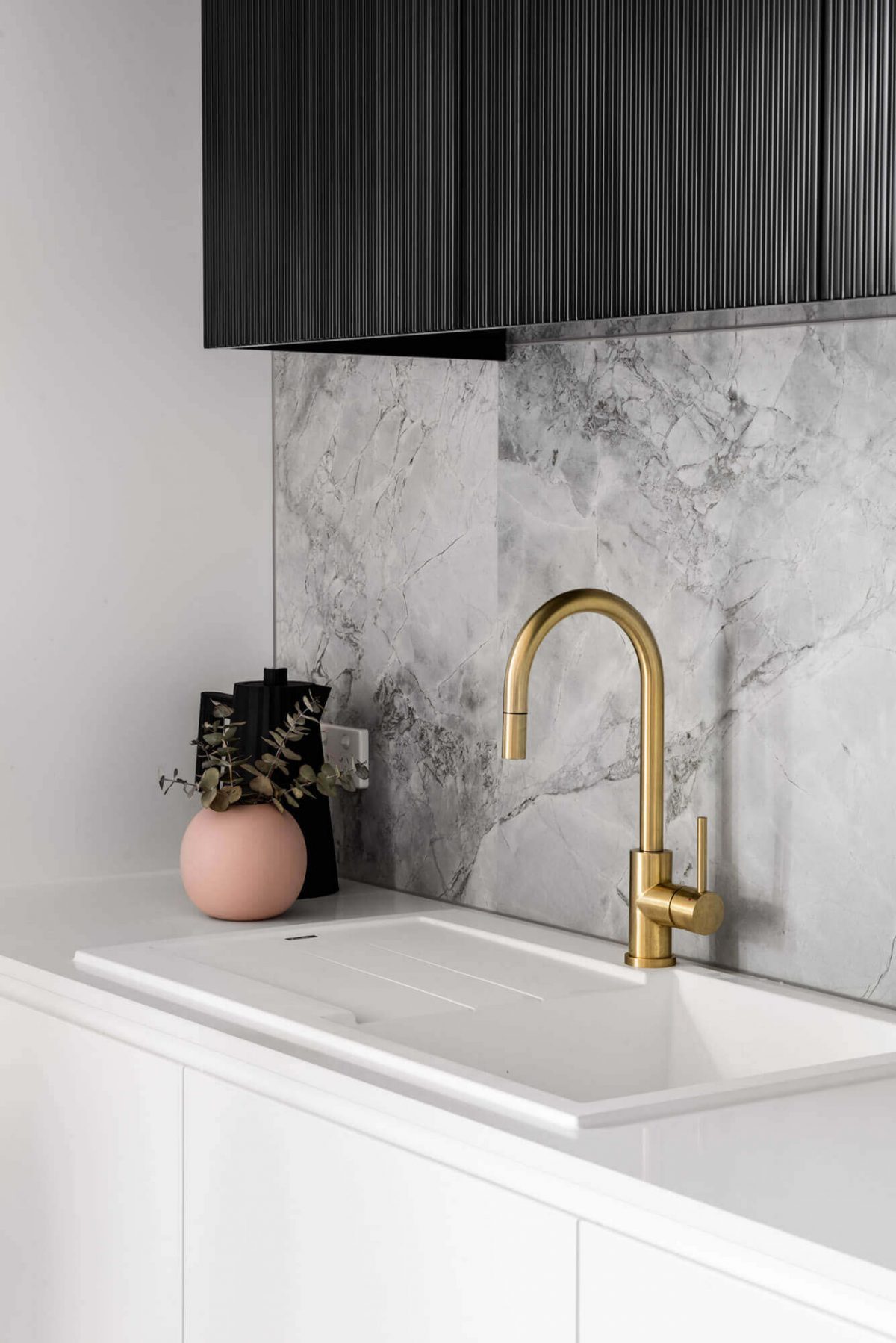 A custom designed monochromatic kitchen. Designed and built by MJ Harris Group.