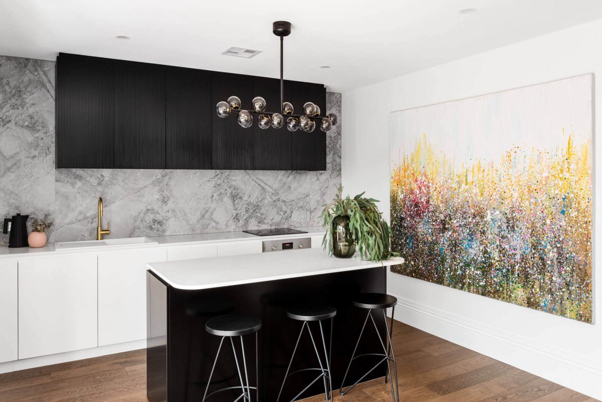 A custom designed monochromatic kitchen. Designed and built by MJ Harris Group.