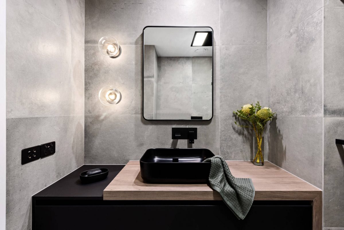 A custom designed monochromatic bathroom. Designed and built by MJ Harris Group.