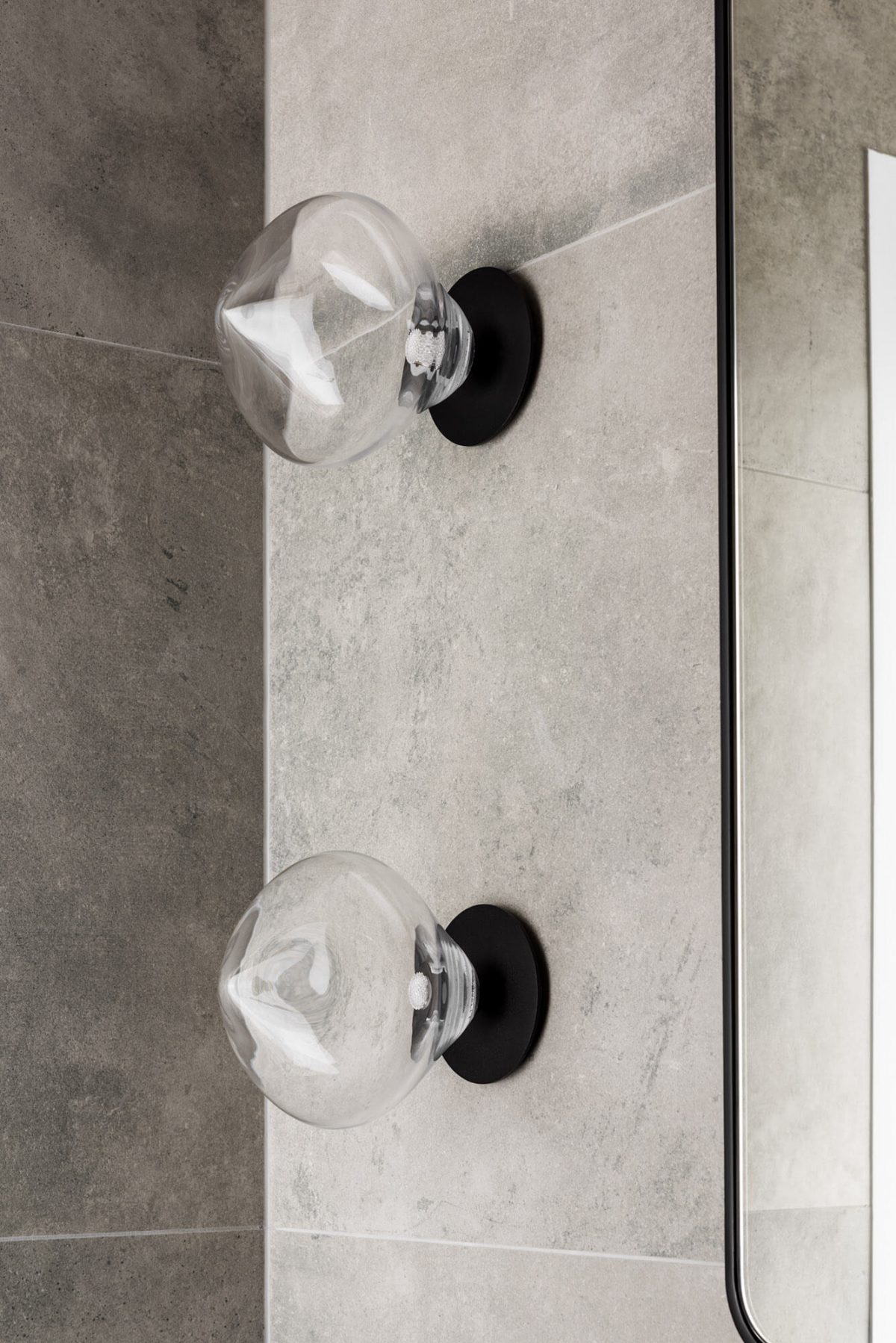 A custom designed monochromatic bathroom. Designed and built by MJ Harris Group.