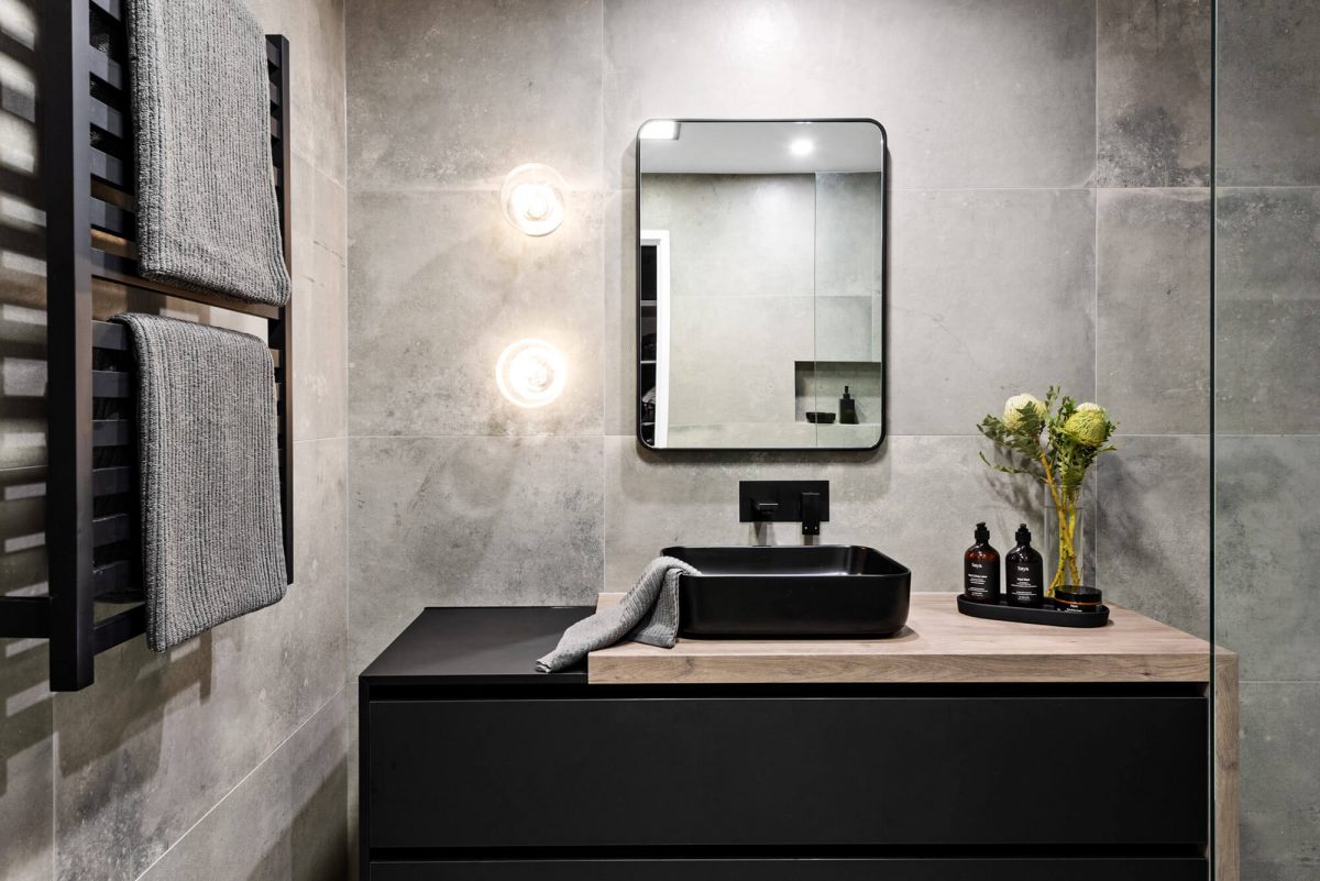A custom designed monochromatic bathroom. Designed and built by MJ Harris Group.