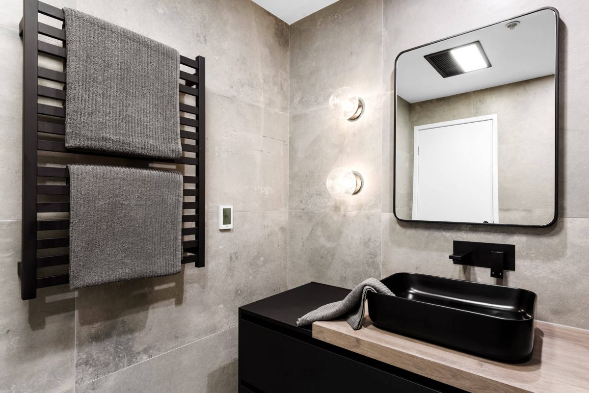 A custom designed monochromatic bathroom. Designed and built by MJ Harris Group.