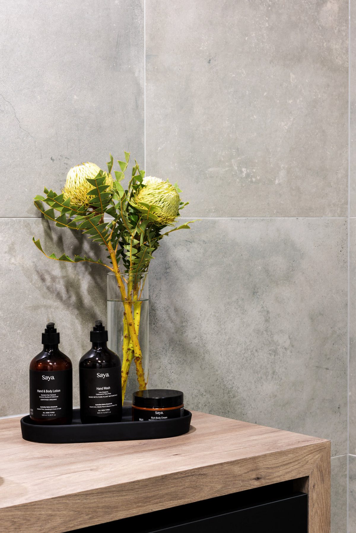 A custom designed monochromatic bathroom. Designed and built by MJ Harris Group.