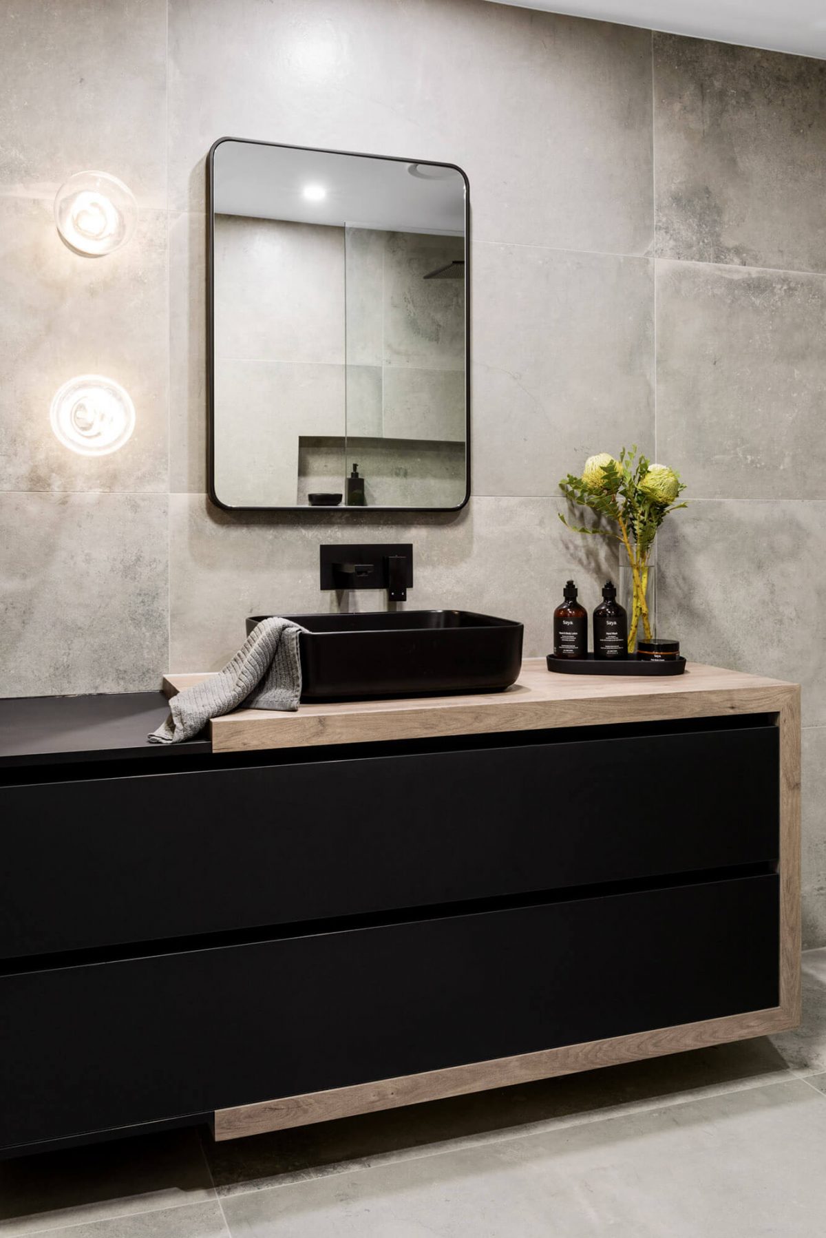 A custom designed monochromatic bathroom. Designed and built by MJ Harris Group.