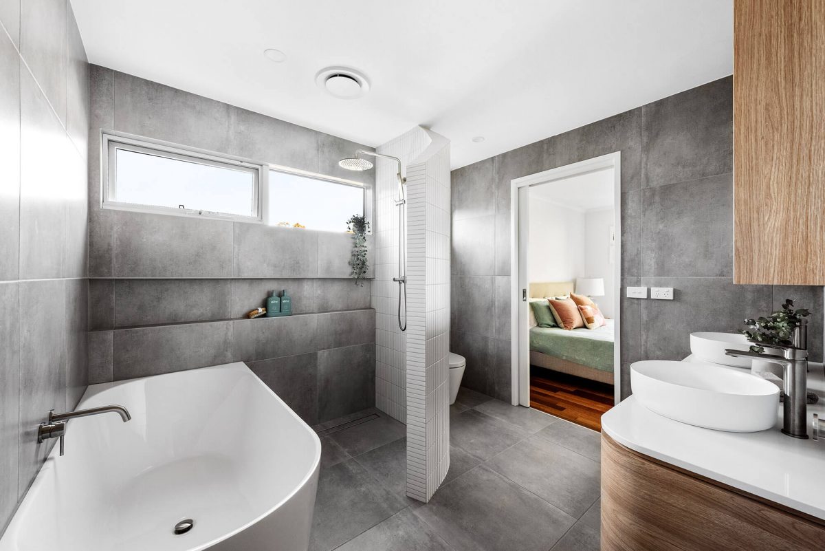 A custom designed Jack and Jill bathroom. Designed and built by MJ Harris Group.