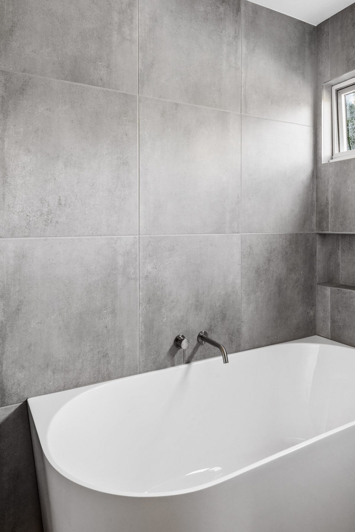 A custom designed Jack and Jill bathroom. Designed and built by MJ Harris Group.