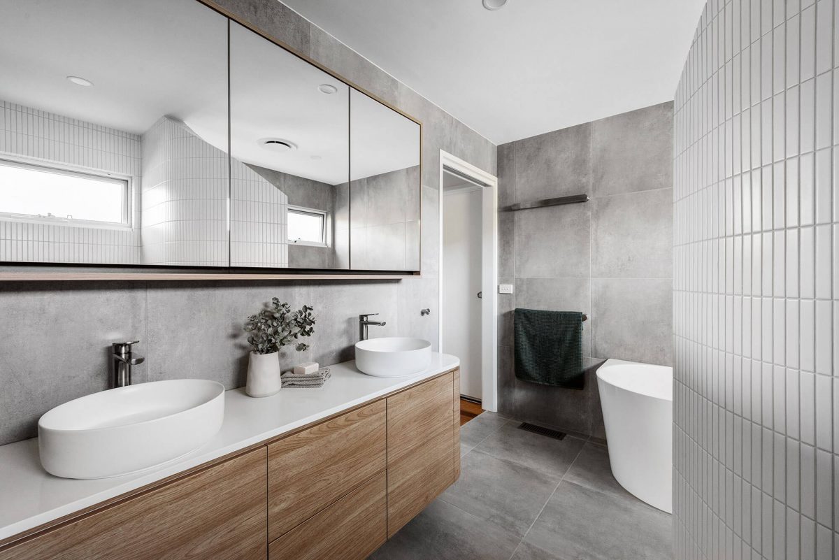 A custom designed Jack and Jill bathroom. Designed and built by MJ Harris Group.