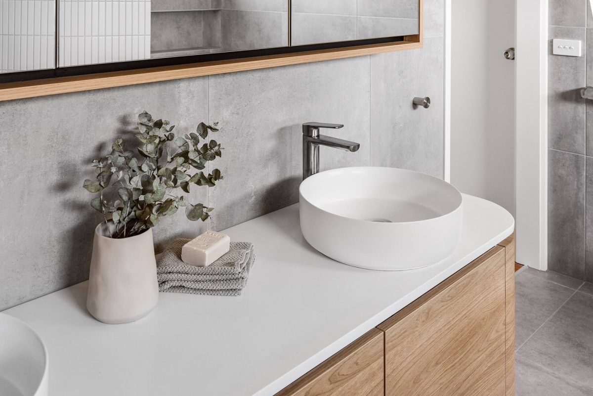 A custom designed Jack and Jill bathroom. Designed and built by MJ Harris Group.