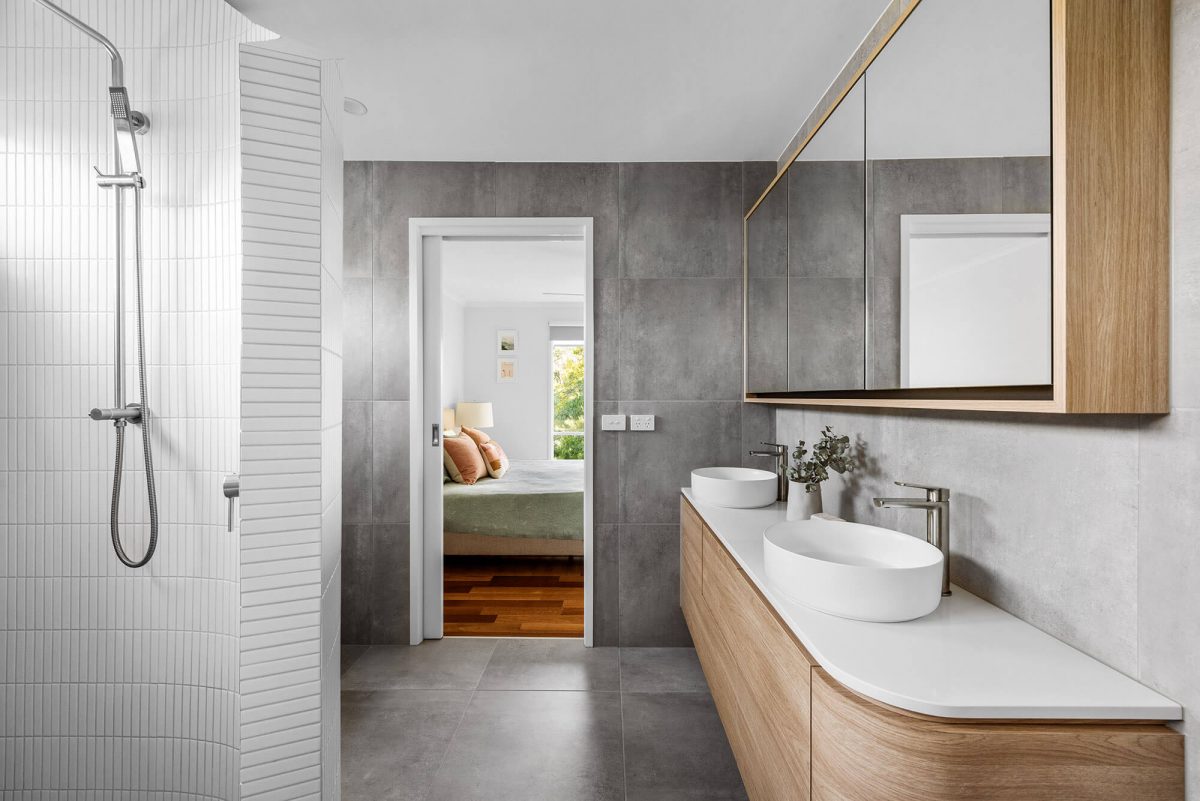 A custom designed Jack and Jill bathroom. Designed and built by MJ Harris Group.