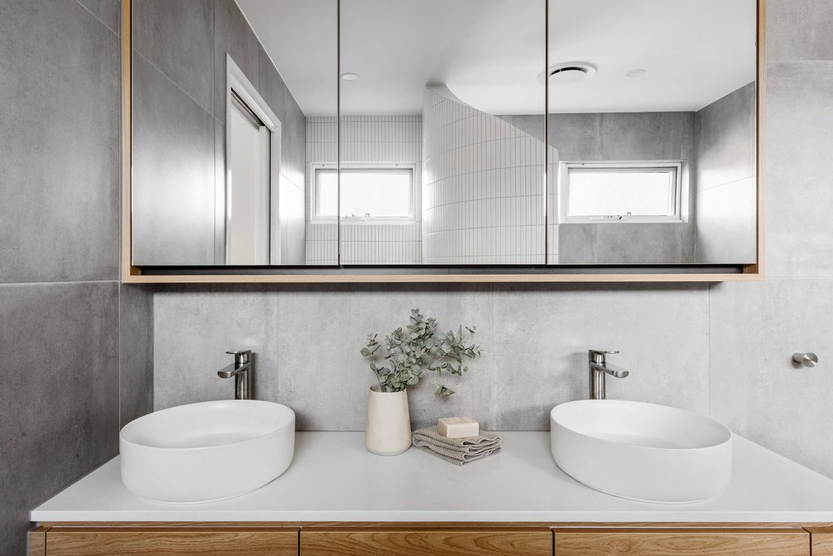 A custom designed Jack and Jill bathroom. Designed and built by MJ Harris Group.