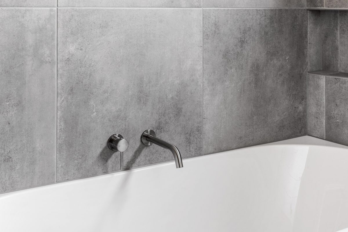 A custom designed Jack and Jill bathroom. Designed and built by MJ Harris Group.