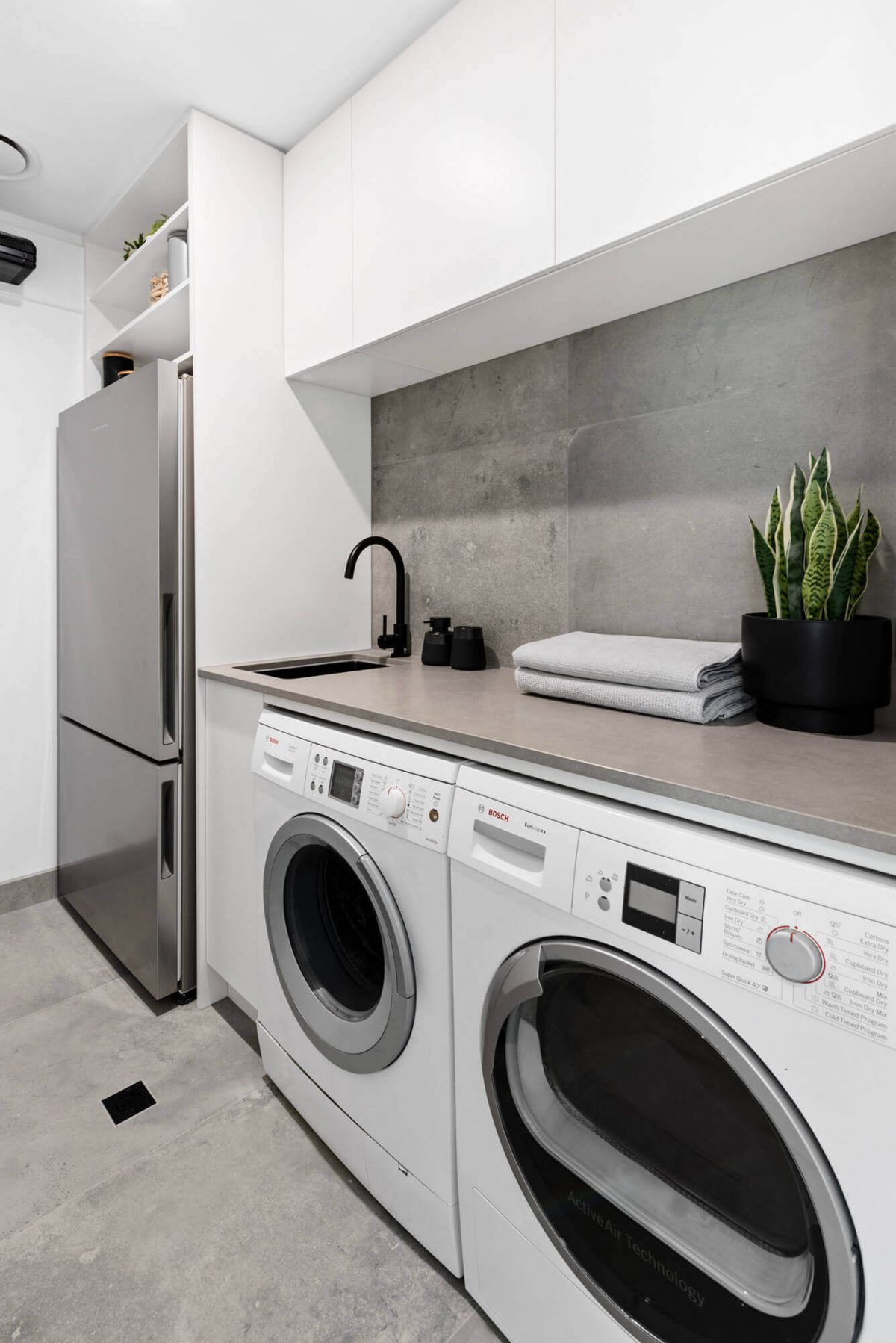 A custom designed laundry. Designed and built by MJ Harris Group.