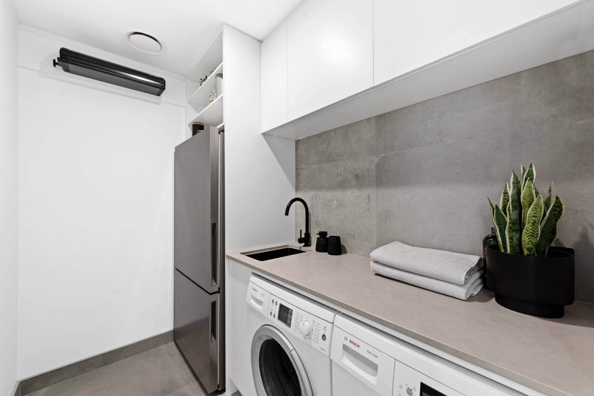 A custom designed laundry. Designed and built by MJ Harris Group.