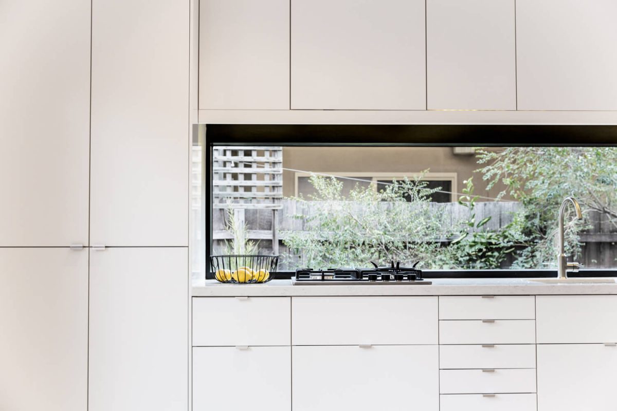 A custom designed kitchen featuring custom joinery. Designed and built by MJ Harris Group.