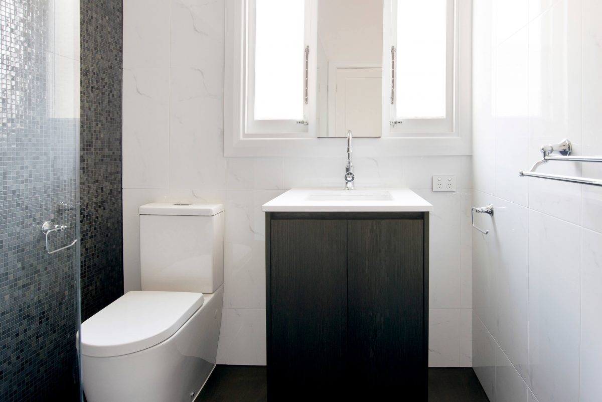A custom designed bathroom featuring chrome fixtures. Designed and built by MJ Harris Group. #MJHxSheirsSt