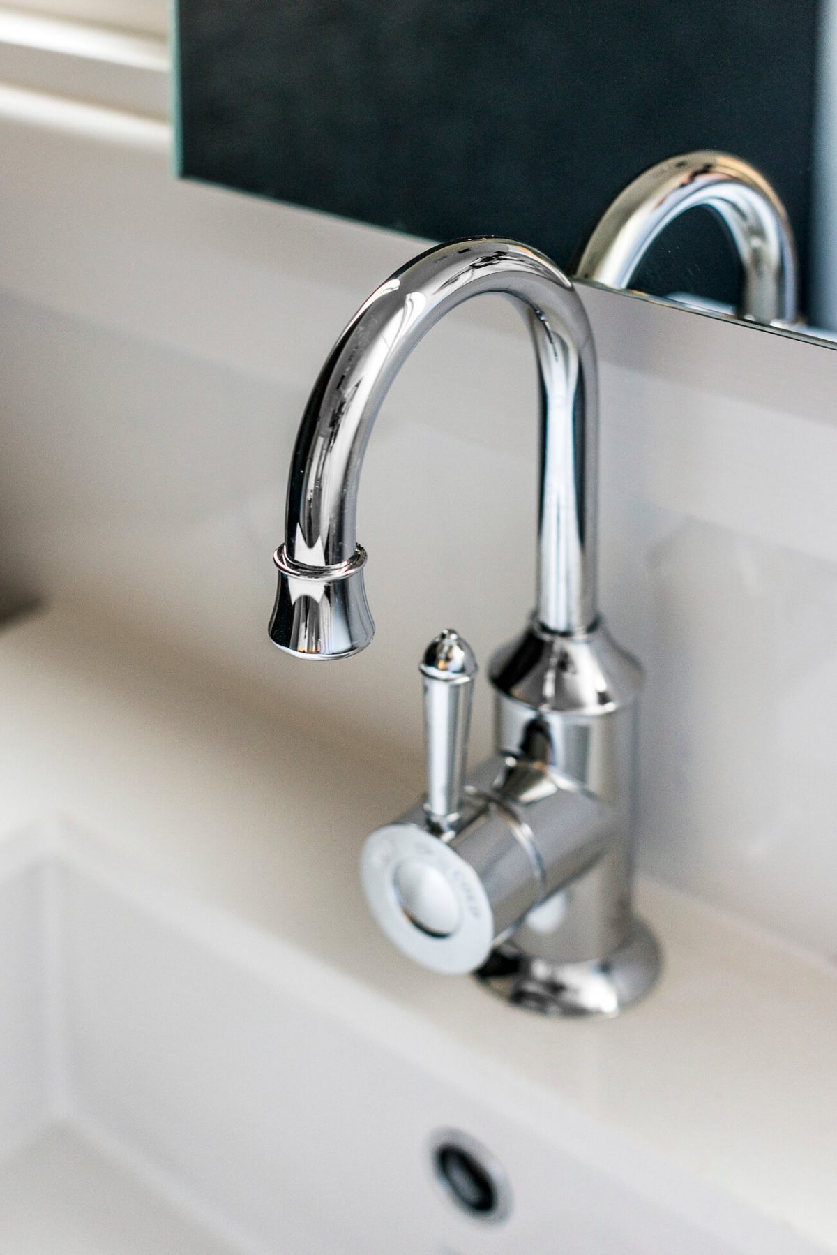 A custom designed bathroom featuring chrome fixtures. Designed and built by MJ Harris Group. #MJHxSheirsSt