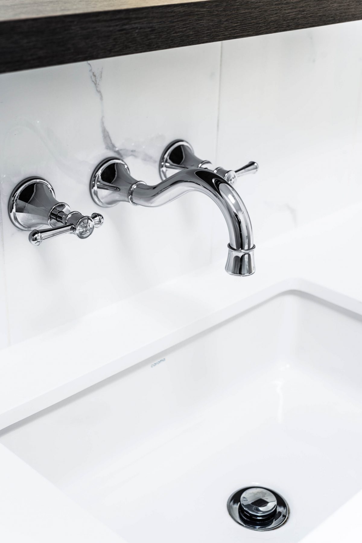 A custom designed bathroom featuring chrome fixtures. Designed and built by MJ Harris Group. #MJHxSheirsSt