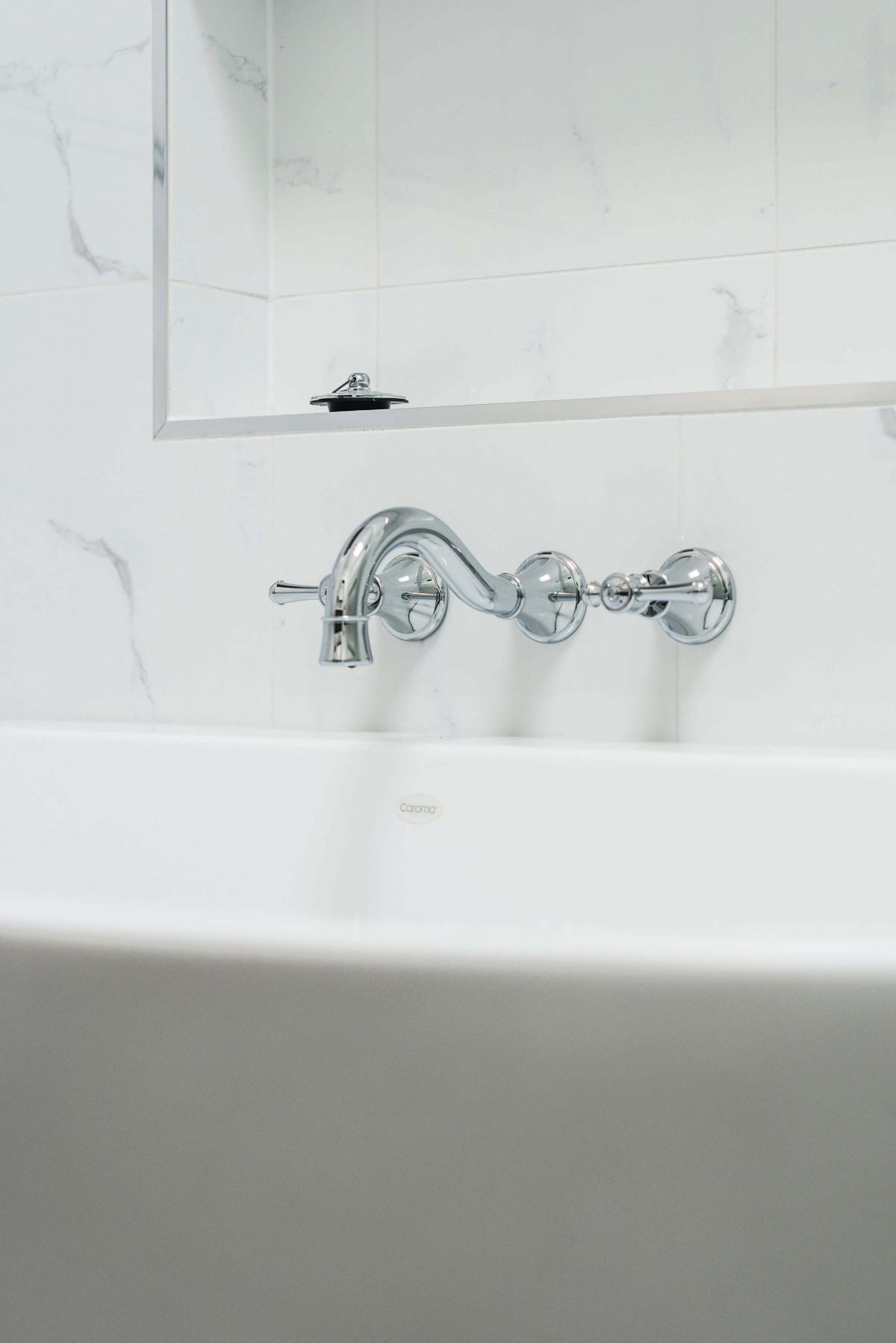 A custom designed bathroom featuring chrome fixtures. Designed and built by MJ Harris Group. #MJHxSheirsSt