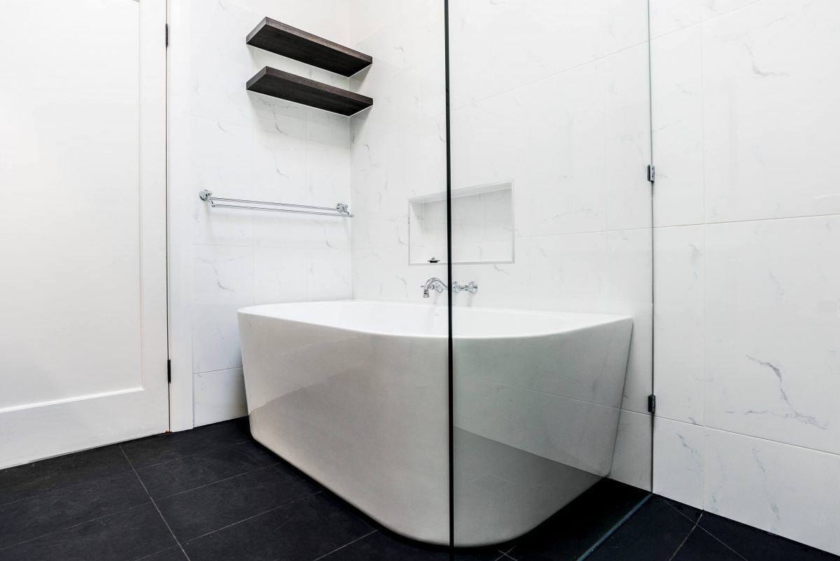 A custom designed bathroom featuring chrome fixtures. Designed and built by MJ Harris Group. #MJHxSheirsSt