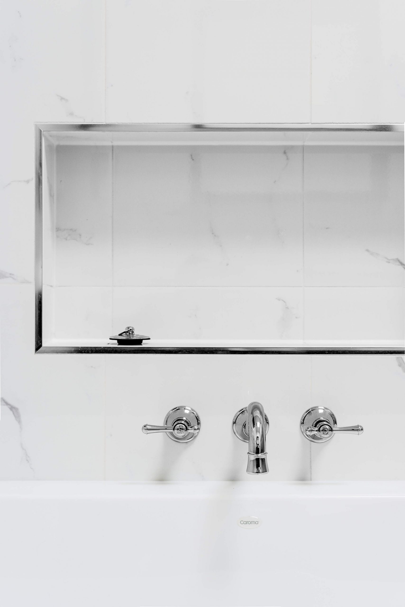 A custom designed bathroom featuring chrome fixtures. Designed and built by MJ Harris Group. #MJHxSheirsSt