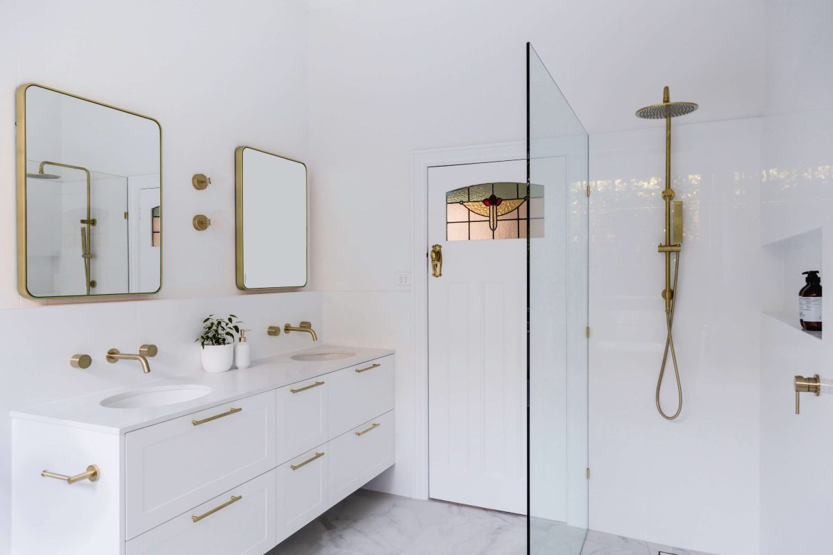 A custom designed bathroom featuring gold fixtures. Designed and built by MJ Harris Group. #MJHxSycamoreSt