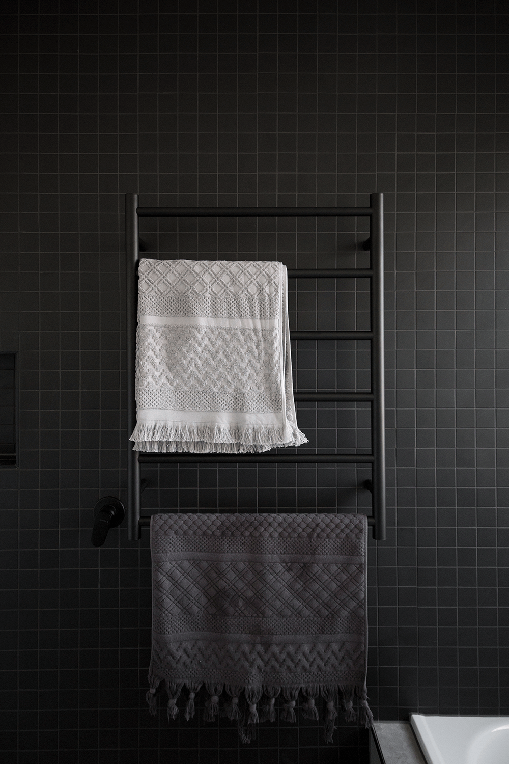 A custom designed bathroom featuring dark tones. Designed and built by MJ Harris Group. #MJHxLamondCrt