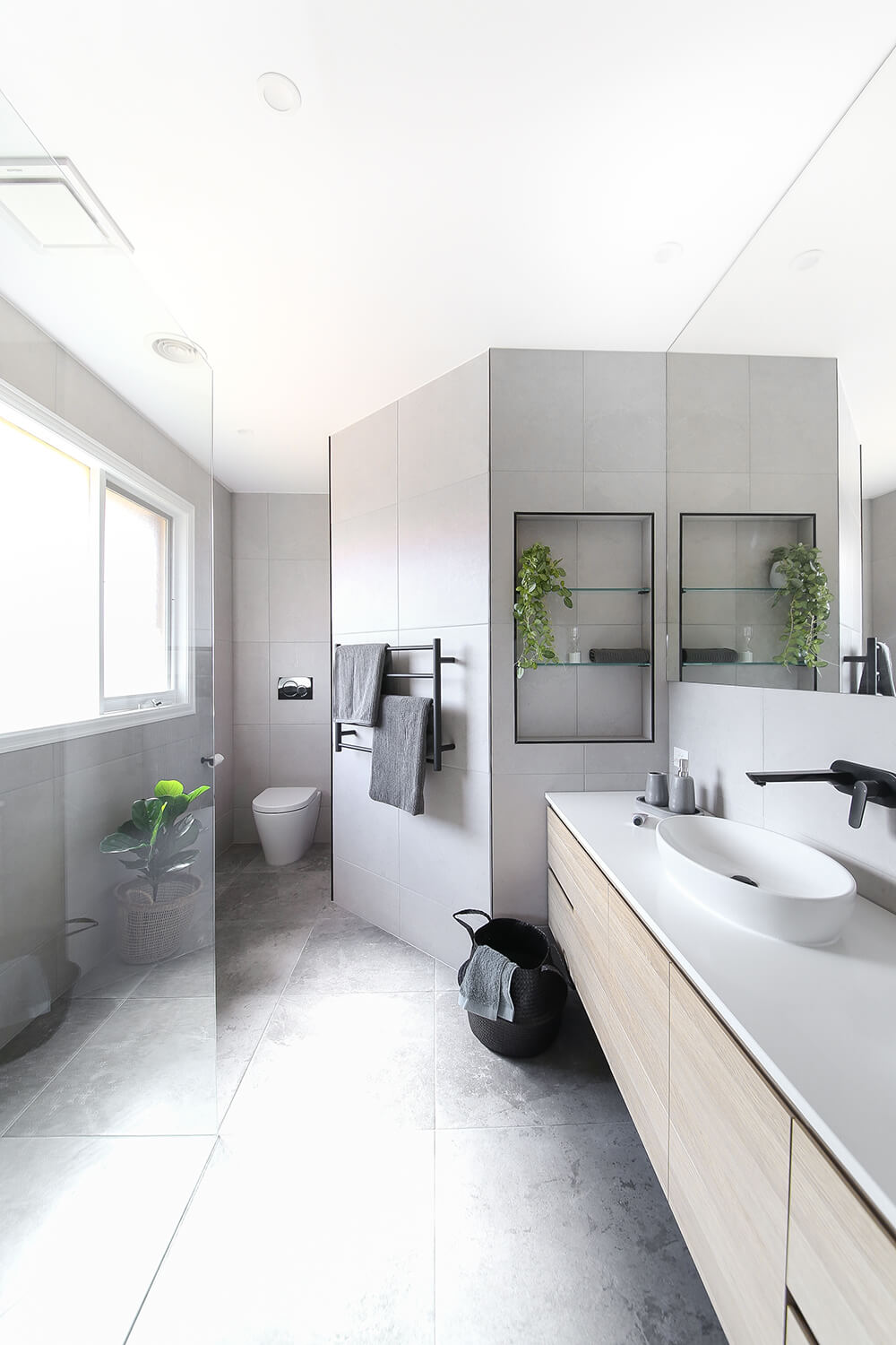 A custom designed bathroom featuring custom joinery. Designed and built by MJ Harris Group. #MJHxDryCreekDr