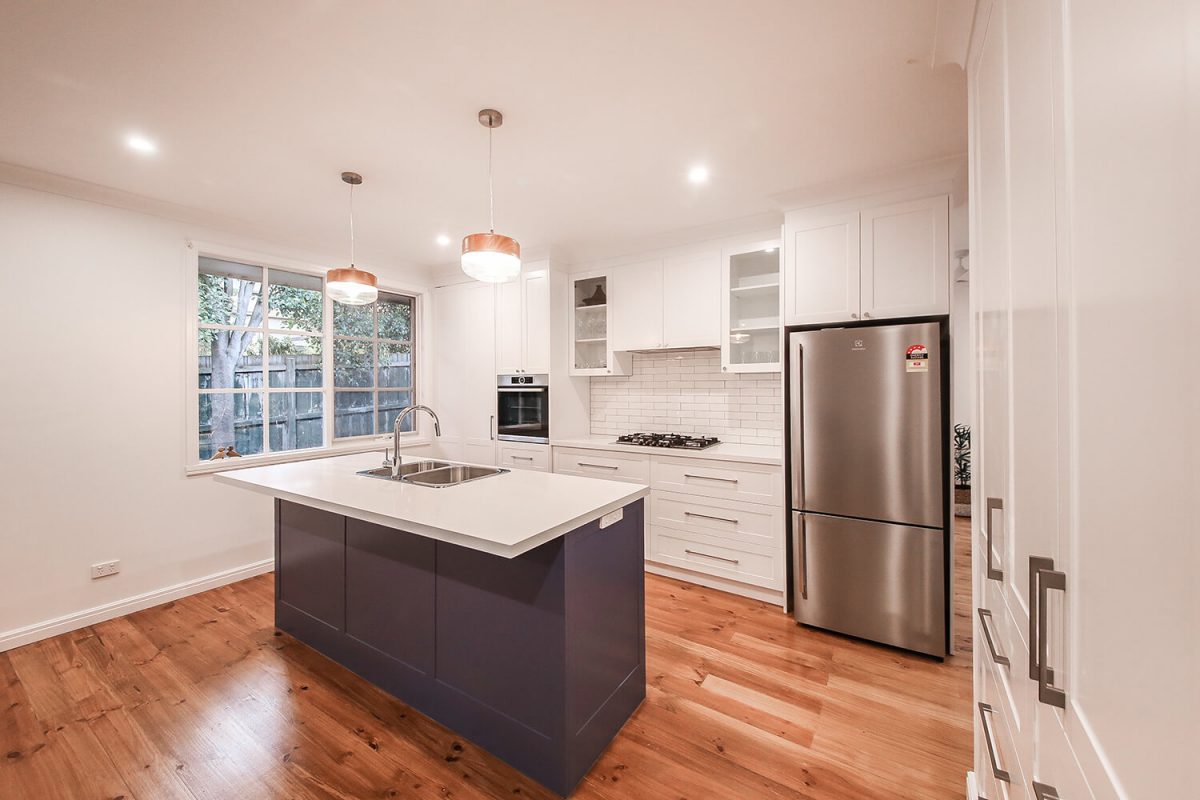A custom designed kitchen featuring subway tiles. Designed and built by MJ Harris Group.