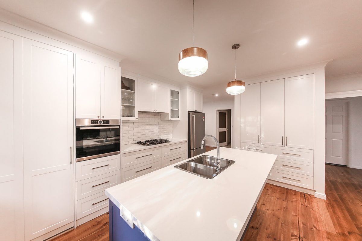 A custom designed kitchen featuring subway tiles. Designed and built by MJ Harris Group.