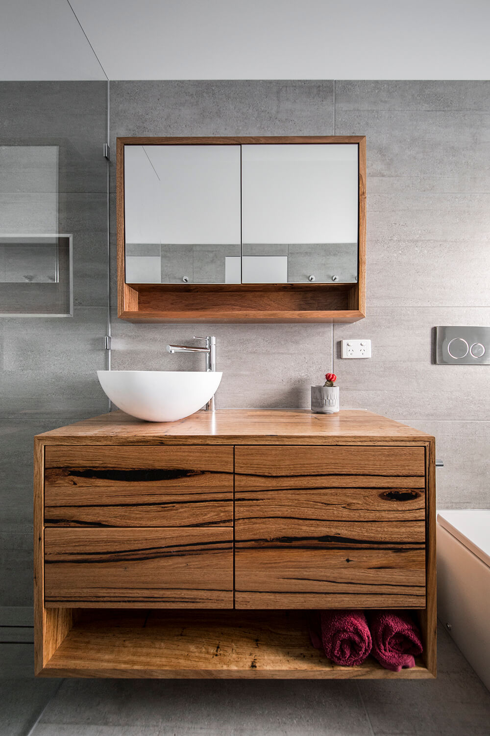 A custom designed bathroom featuring custom joinery. Designed and built by MJ Harris Group. #MJHxGoochSt