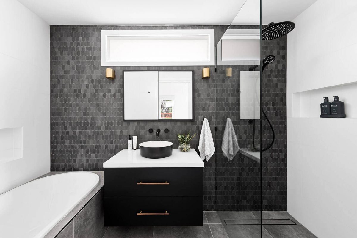 A custom designed bathroom featuring a tiled wall. Designed and built by MJ Harris Group. #MJHxWimmeraSt